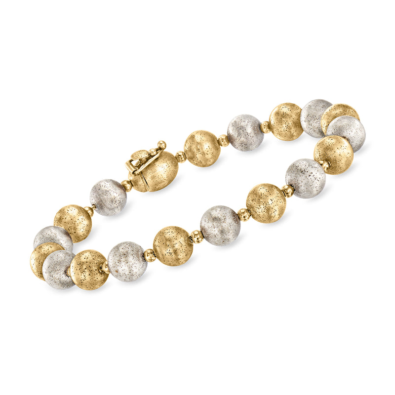 Vintage two-tone gold beaded bracelet with round textured metal beads, clasp