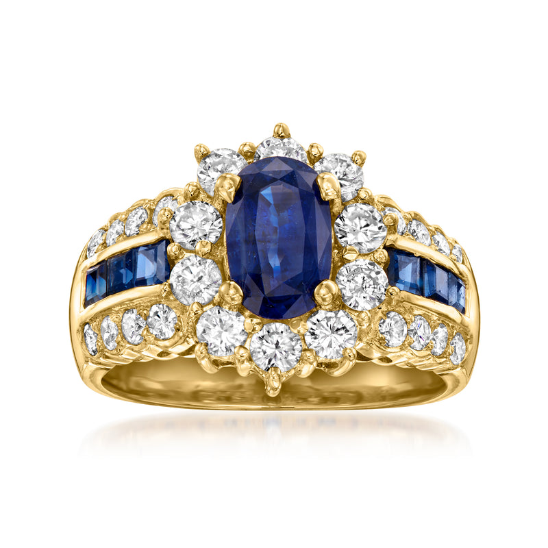 18kt yellow gold ring with oval blue sapphire center and diamond cluster accents