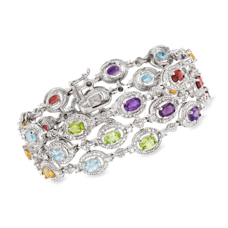 Sterling silver three-row bracelet with assorted round gemstones in purple, green, blue