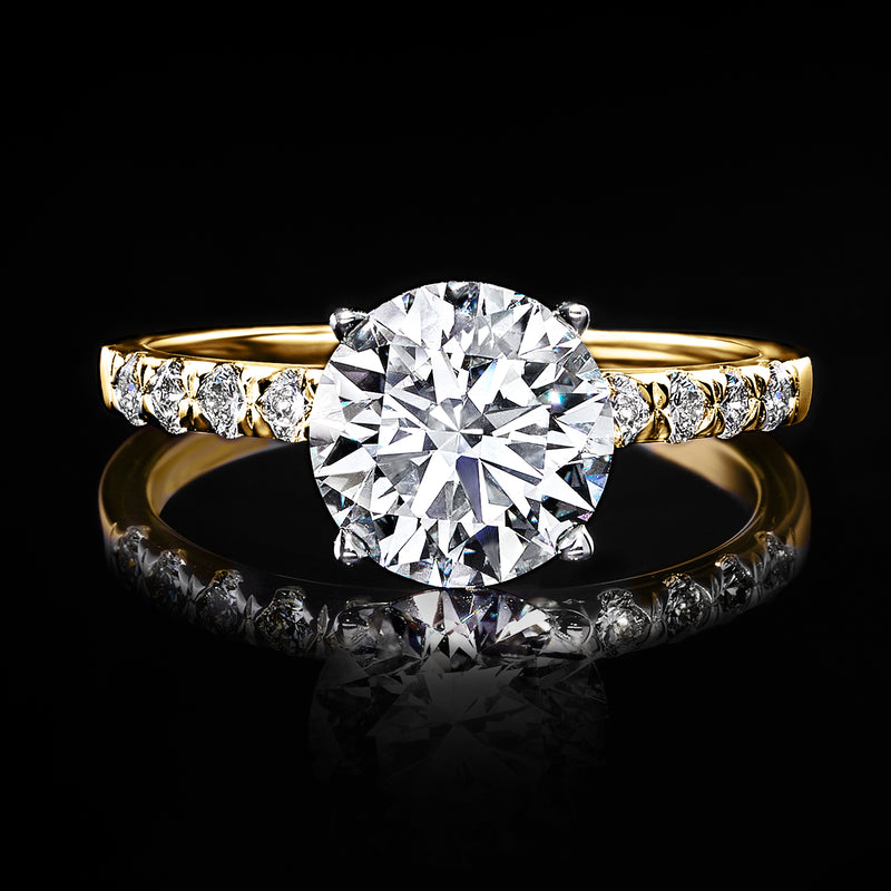 14kt yellow gold engagement ring with large round center lab-grown diamond and side stones