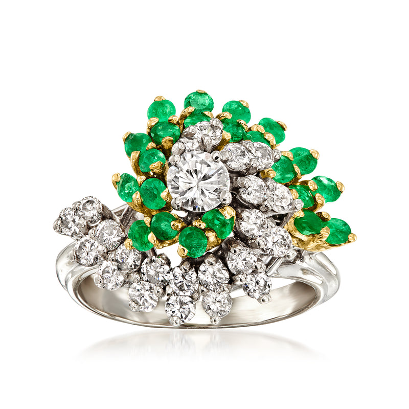 Two-tone gold swirl cocktail ring with green emerald-like stones and round diamonds.