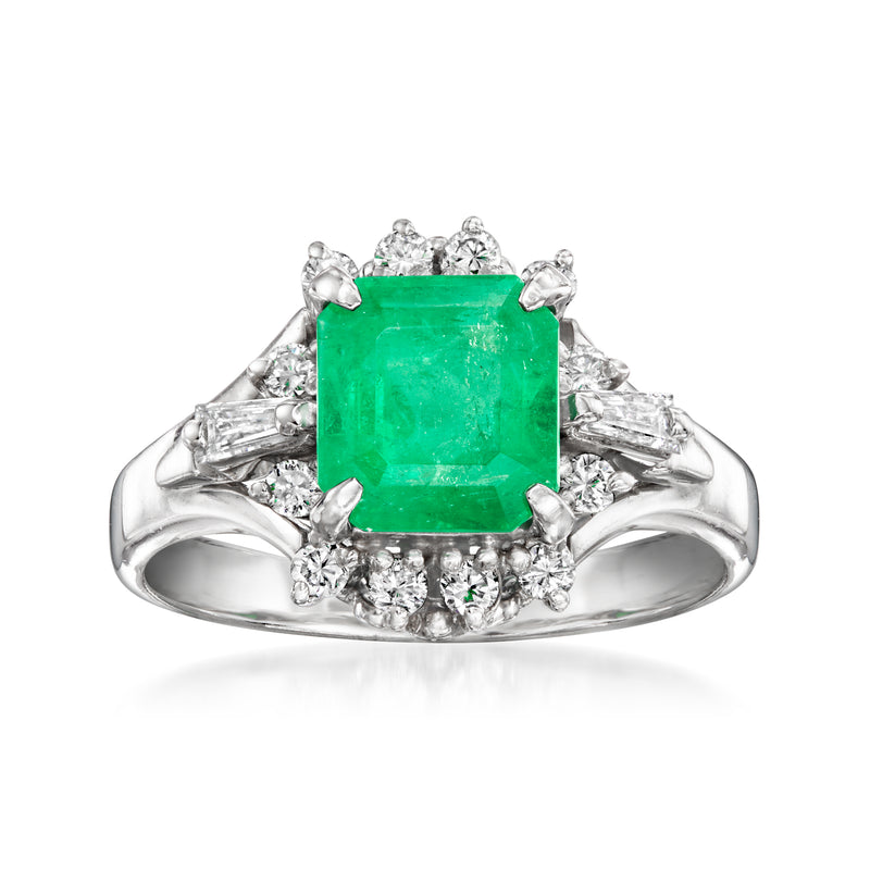Platinum ring with emerald-cut green gemstone and diamond halo