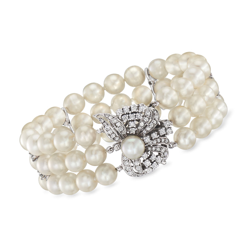 Vintage pearl and diamond three-strand bracelet with ornate clasp in white gold tone