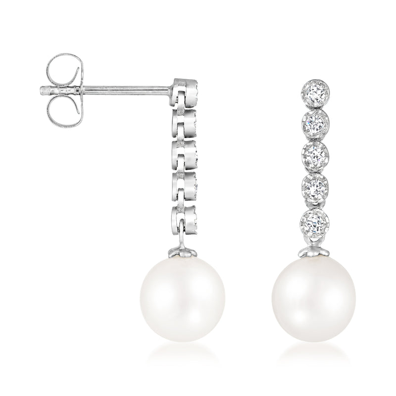 White gold drop earrings with cultured pearl and diamond line cluster, post back shown