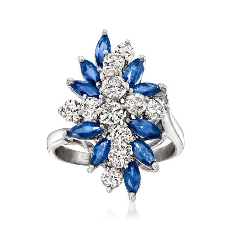 White gold cluster ring with round diamonds and blue marquise sapphire stones