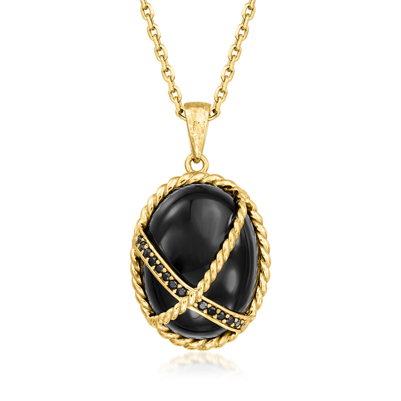 Gold-tone chain necklace with oval black spinel pendant in rope and beaded bezel setting