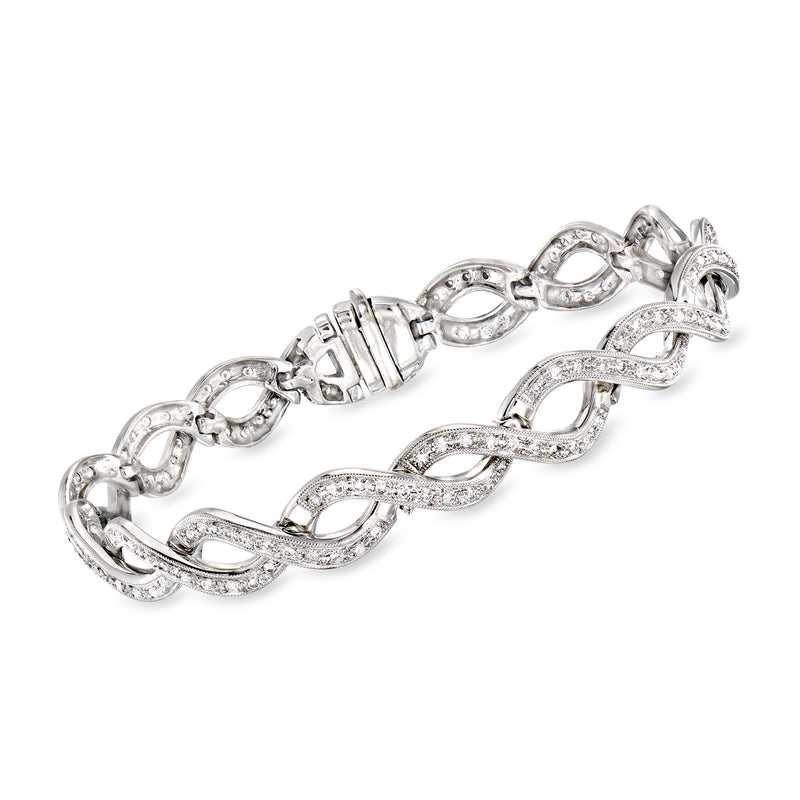 White gold diamond twist bangle bracelet with oval and marquise link settings