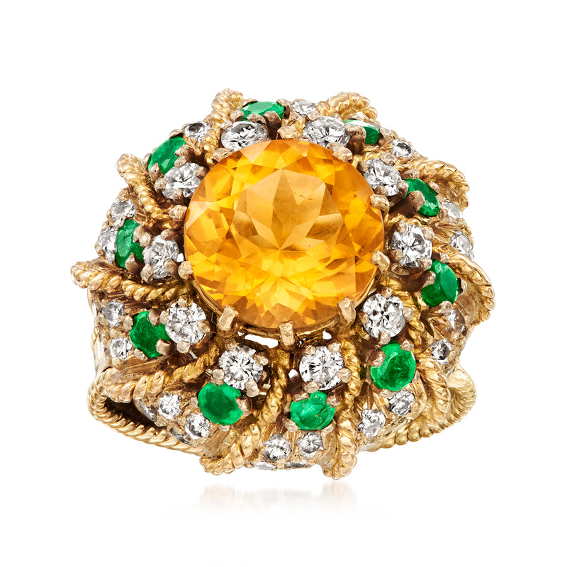 Vintage yellow gold cocktail ring with large yellow citrine center, diamond halo, emerald accents