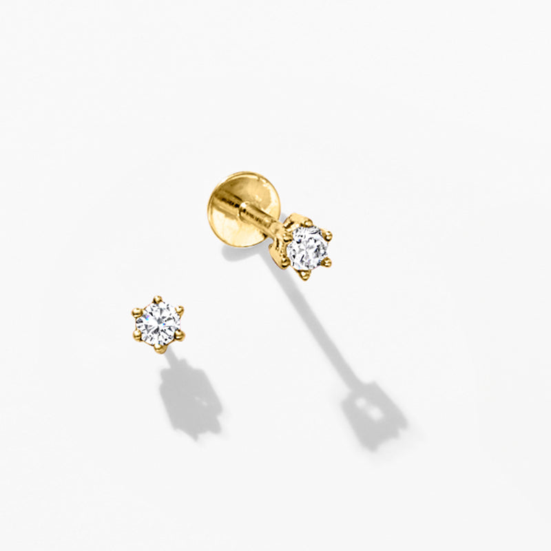 Diamond flat-back stud earrings in 14kt yellow gold, round stones