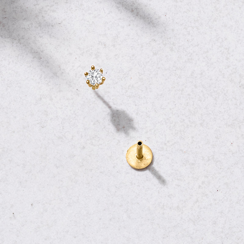Diamond stud earring with 14kt yellow gold flat-back post, viewed from side
