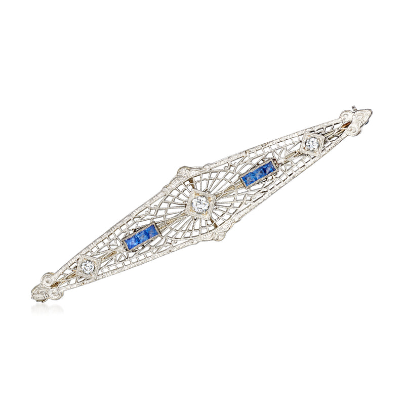 Vintage white gold filigree pin with blue sapphire and diamond accents