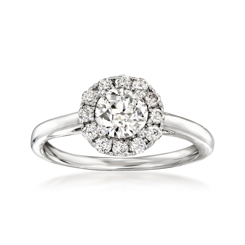 Vintage diamond ring in 18kt white gold with round center stone and halo