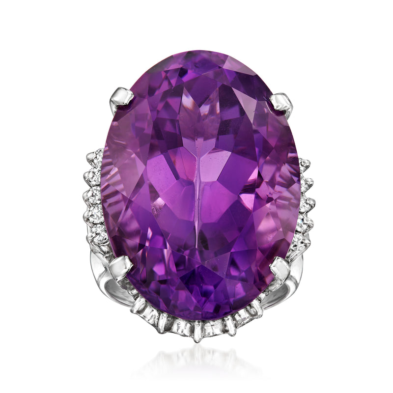 Platinum ring with large oval amethyst and diamond accents in halo setting