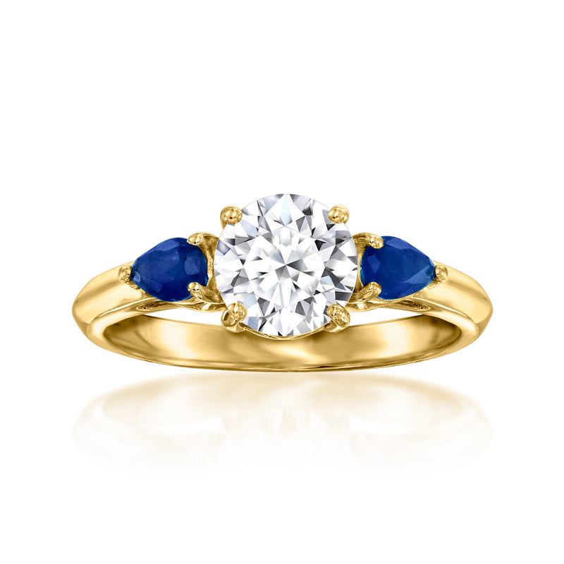 14kt yellow gold ring with round diamond center and blue sapphire side stones