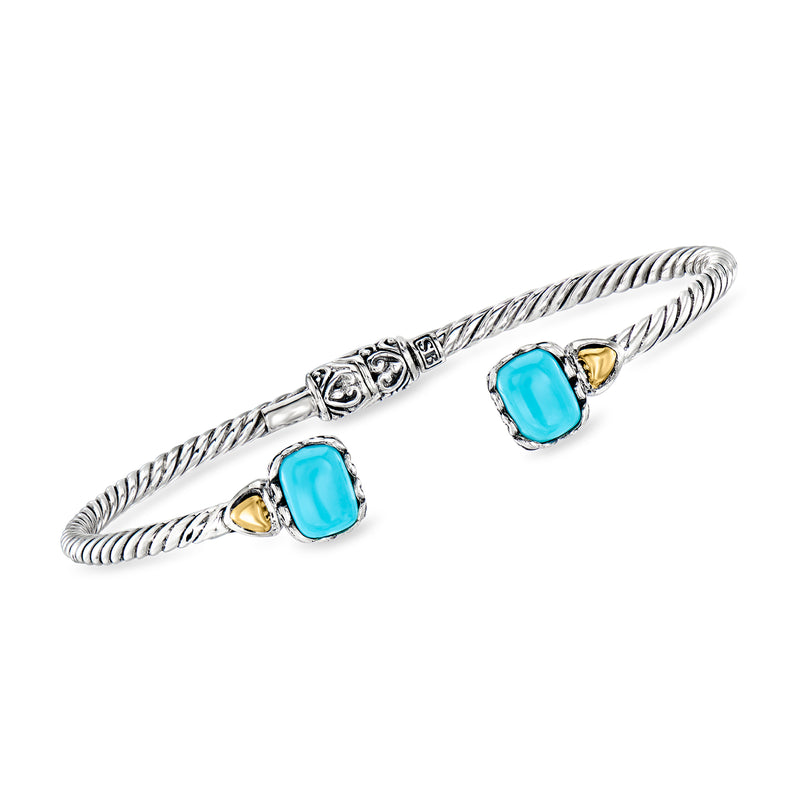 Sterling silver braided cuff bracelet with two turquoise oval stones and yellow gold accents