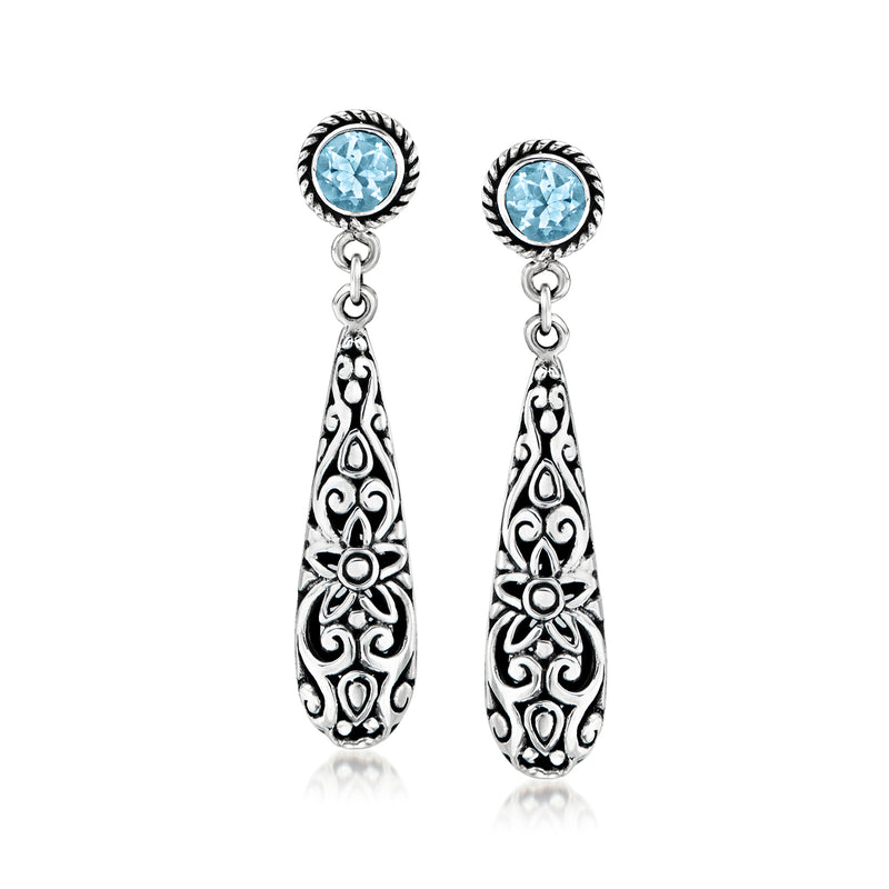Sterling silver Bali-style drop earrings with round blue topaz and ornate teardrop filigree