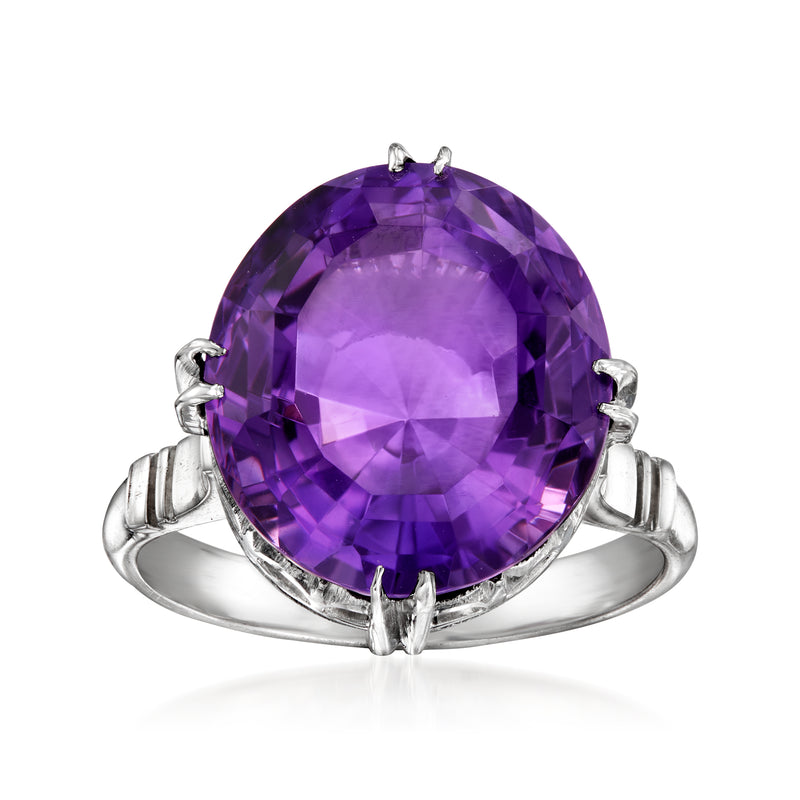 Platinum amethyst ring with large purple oval gemstone and raised prong setting