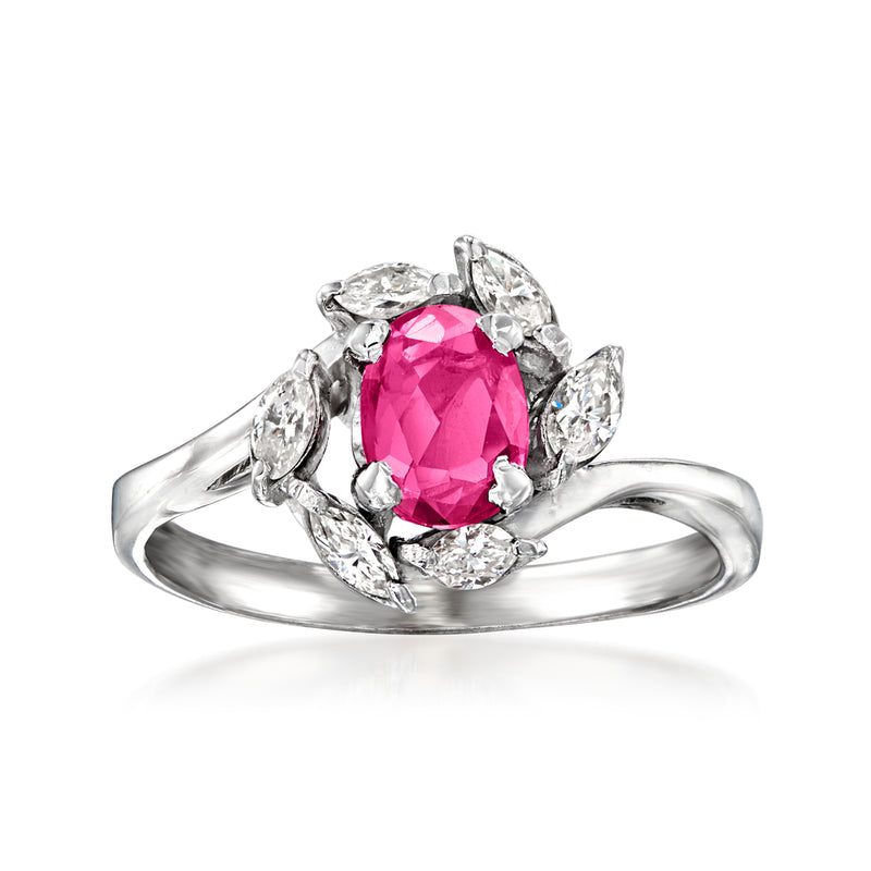 Platinum vintage ring with oval pink ruby center and diamond halo and side stones