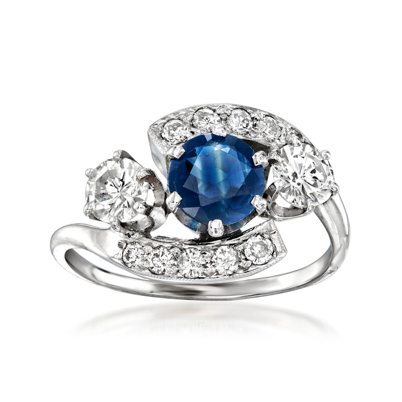 White gold sapphire and diamond ring with blue center stone and round diamond accents