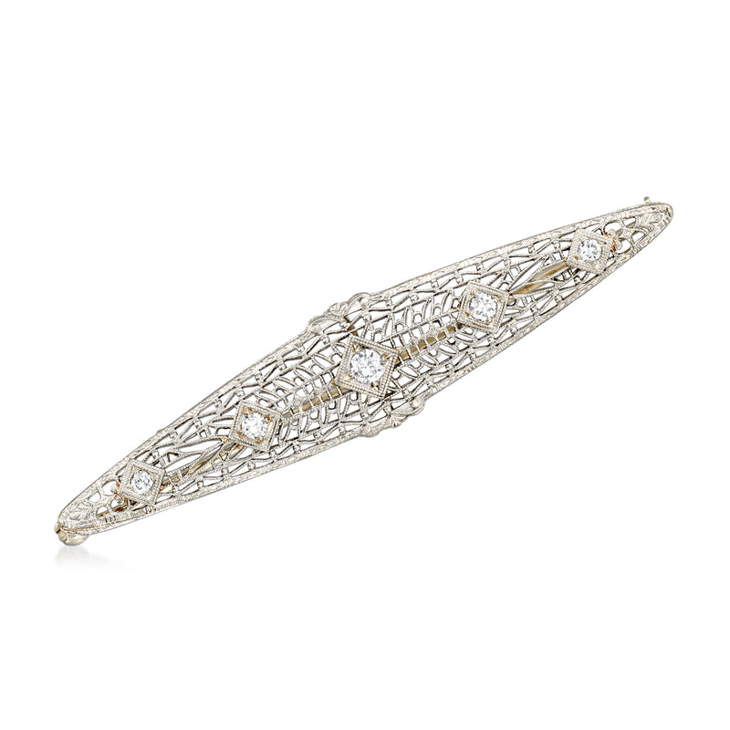 Vintage diamond filigree pin with platinum and white gold setting, elongated oval