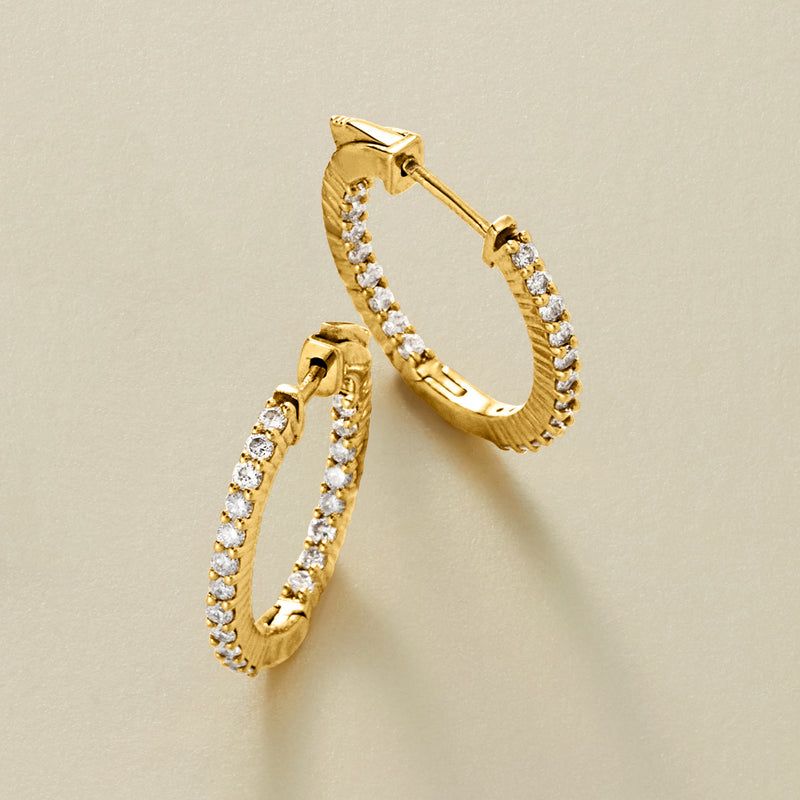 Gold inside-out hoop earrings with pavé diamonds