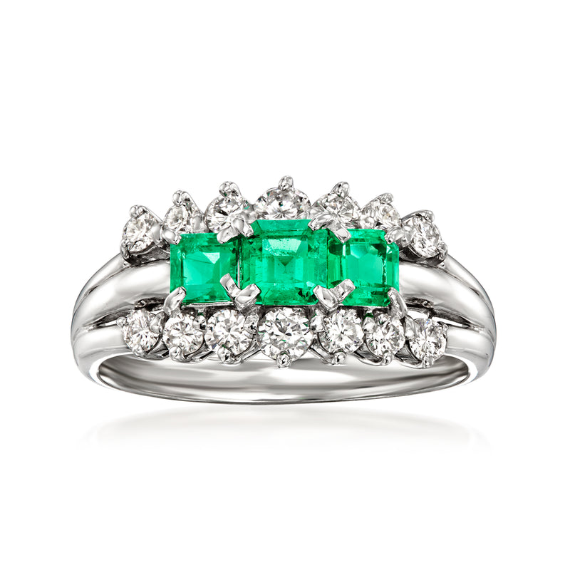 Platinum vintage ring with emerald center and diamond halo cluster, split shank