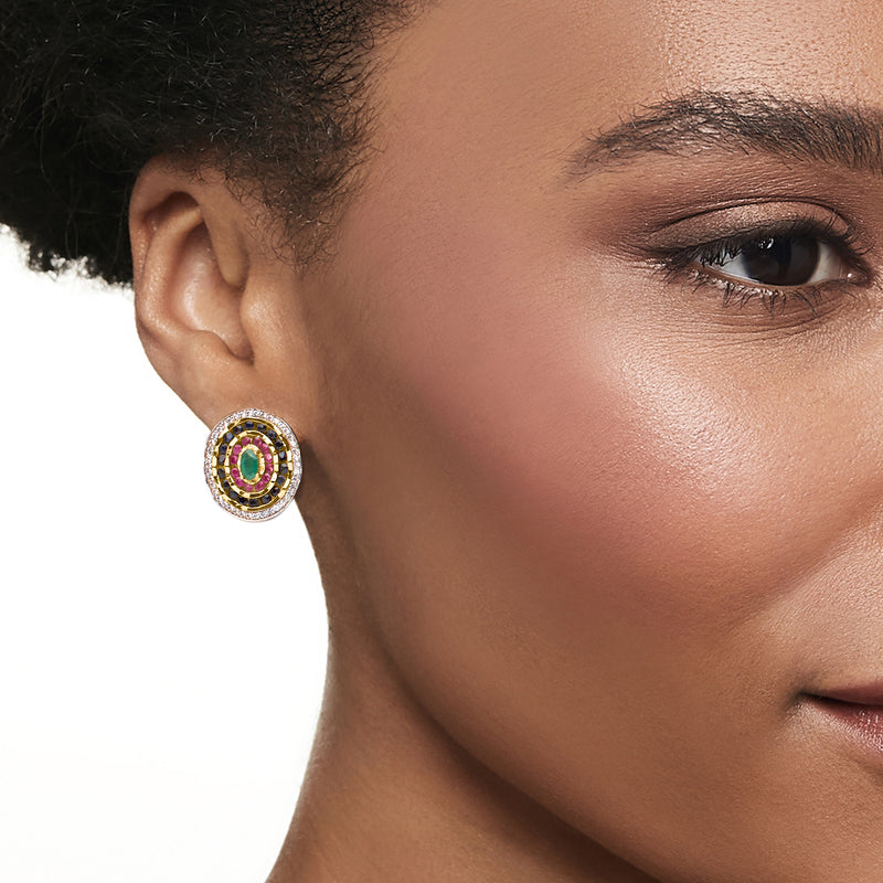 Multi-gem cluster stud earring on ear: green oval center with pink and blue stones in gold