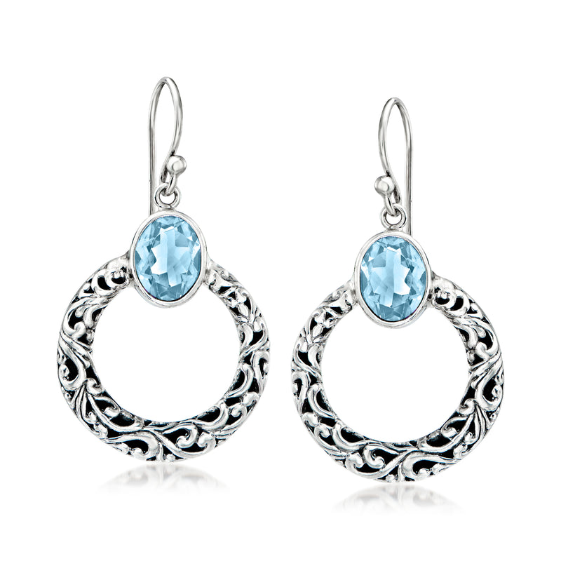 Sterling silver drop earrings with blue topaz oval stones and filigree hoop frames
