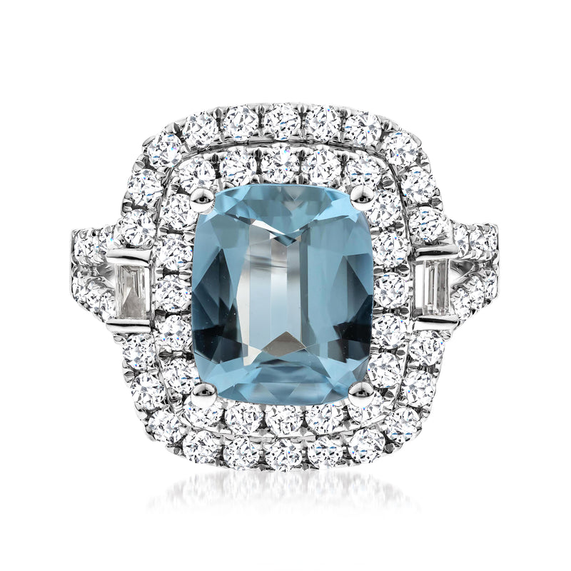 Cushion aquamarine diamond halo ring in 14kt white gold with baguette accents