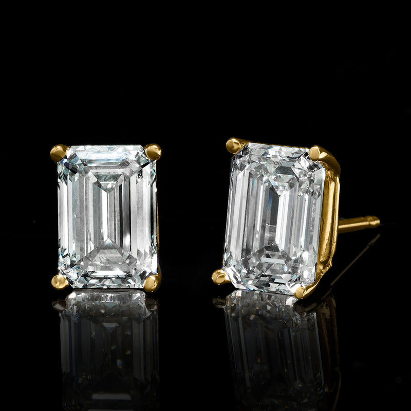 Emerald-cut diamond stud earrings in 14kt yellow gold, four-prong settings