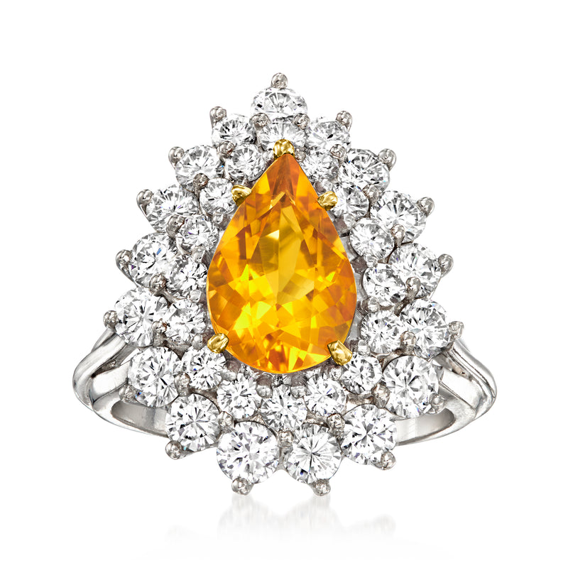 Vintage platinum ring with pear-cut yellow citrine center and diamond halo, split shank.