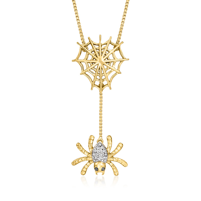 Gold-tone spider web necklace with marquise diamond spider pendant and small stones