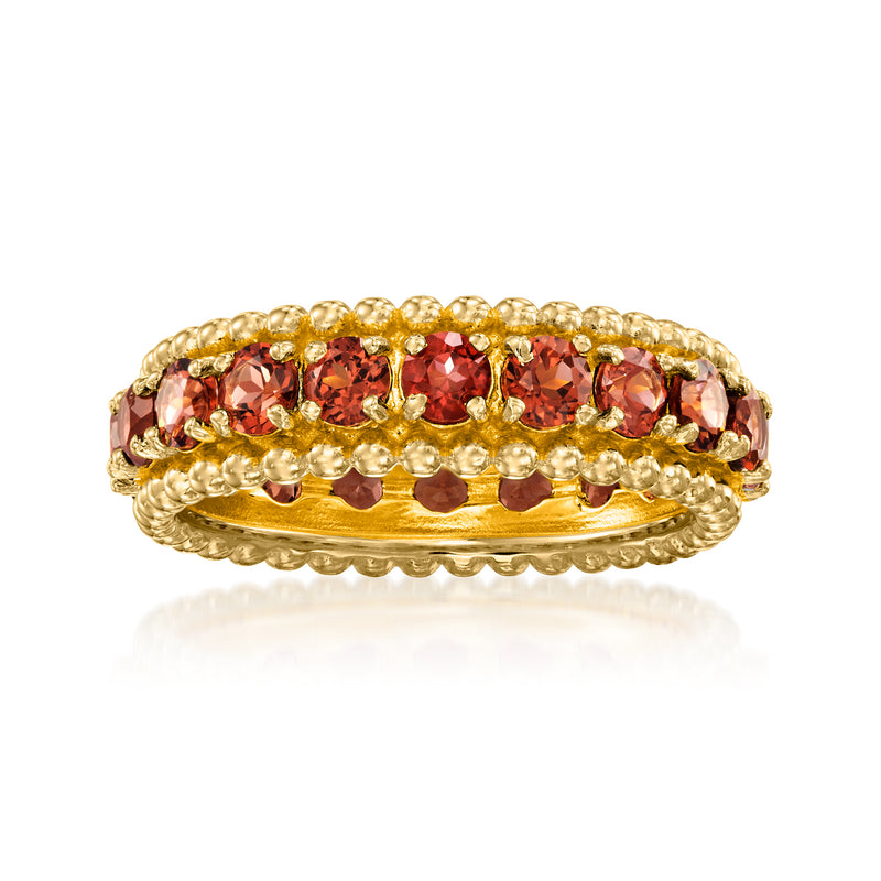 18k gold over sterling eternity band with round red garnet stones across top