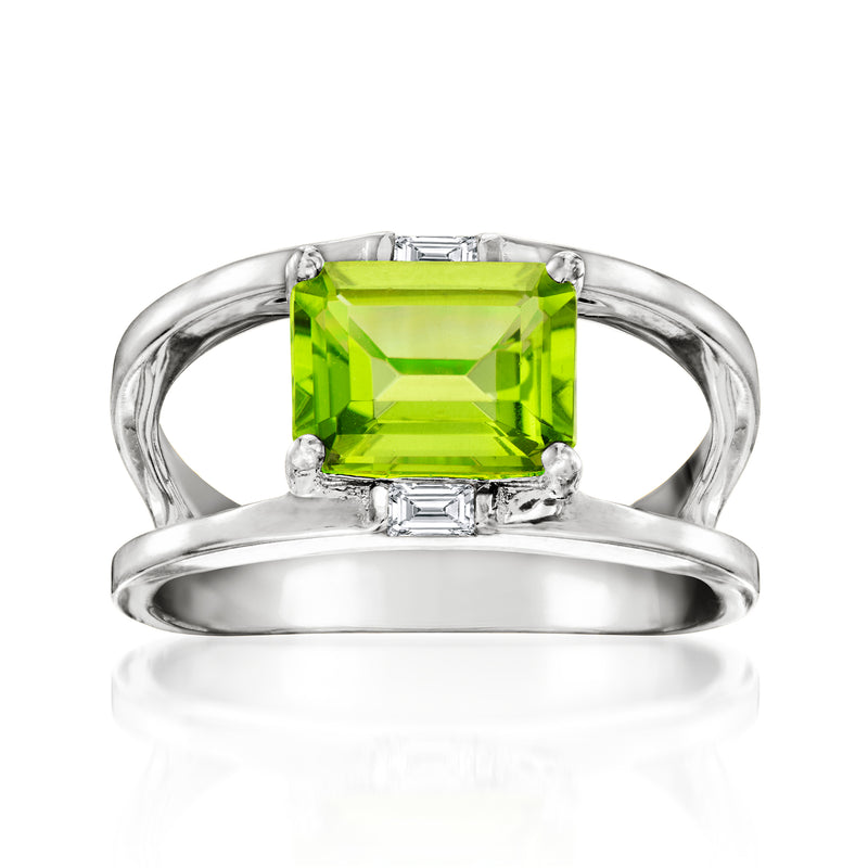 Sterling silver open-space ring with green emerald-cut center stone
