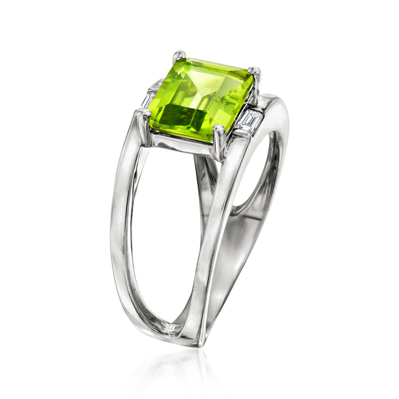 Sterling silver open-space ring with green emerald-cut center and white side accents