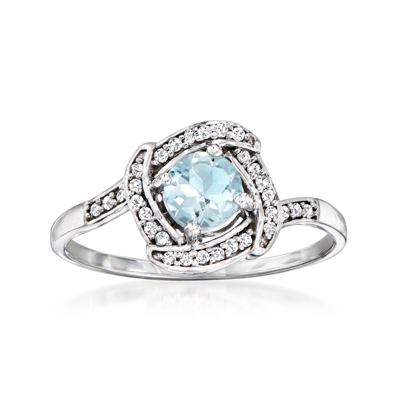 14kt white gold ring with aquamarine center and diamond accents halo setting