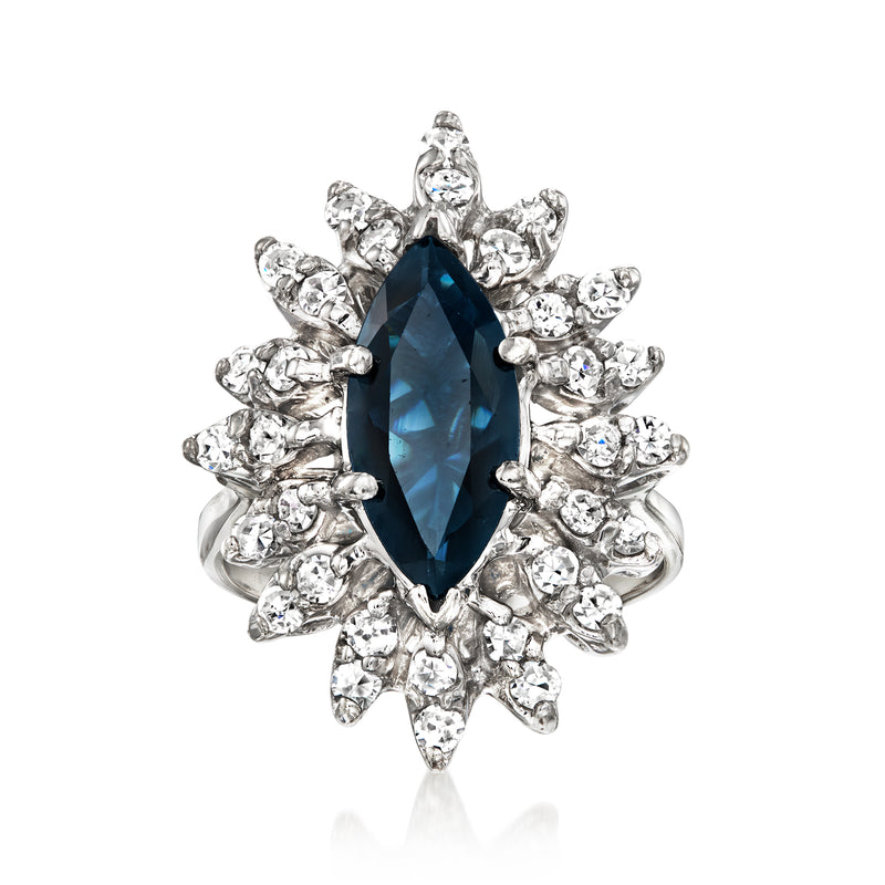 Vintage sapphire and diamond ring with oval blue center stone, white gold setting