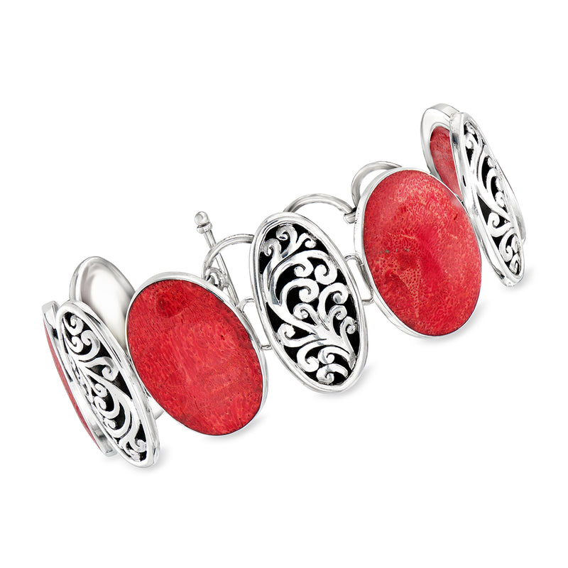 Sterling silver Bali-style bracelet with red oval coral cabochons and ornate filigree links