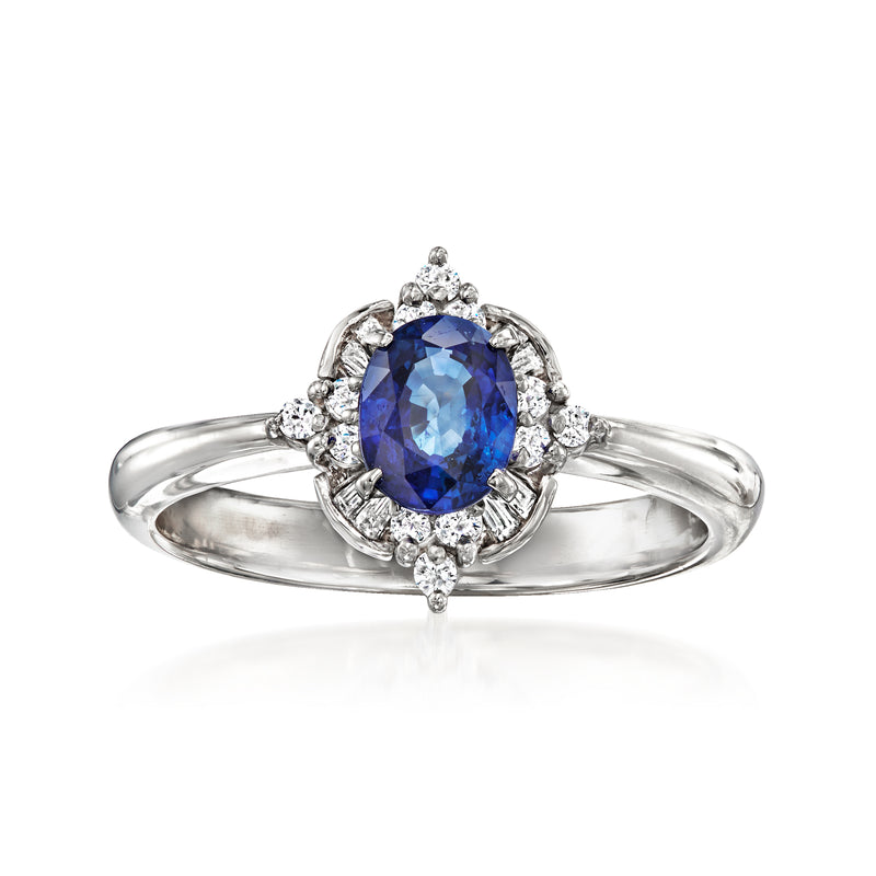 Platinum vintage ring with oval blue sapphire center and diamond halo and side accents