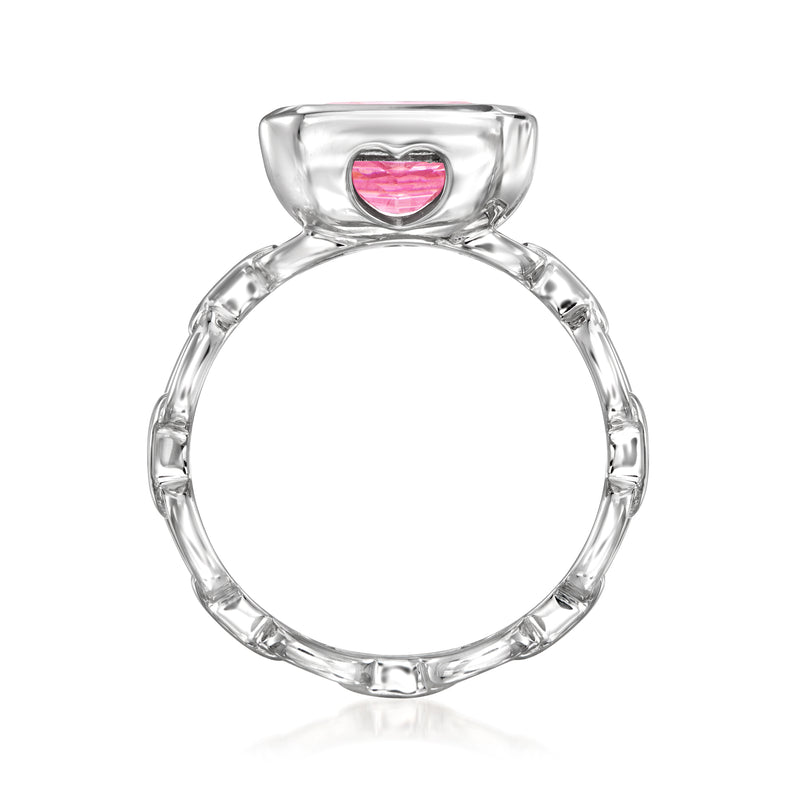 Sterling silver ring with heart-shaped pink gemstone on top of a circular band