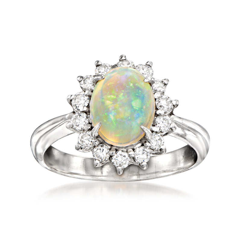 Platinum vintage opal ring with round diamond halo and clustered side stones