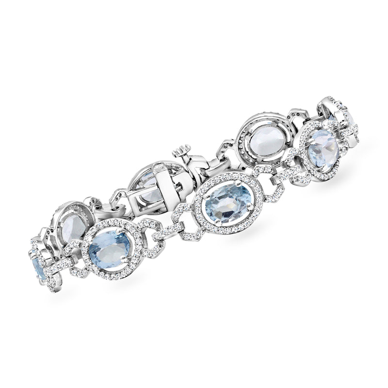 Sterling silver tennis bracelet with oval sky blue topaz and white topaz stones