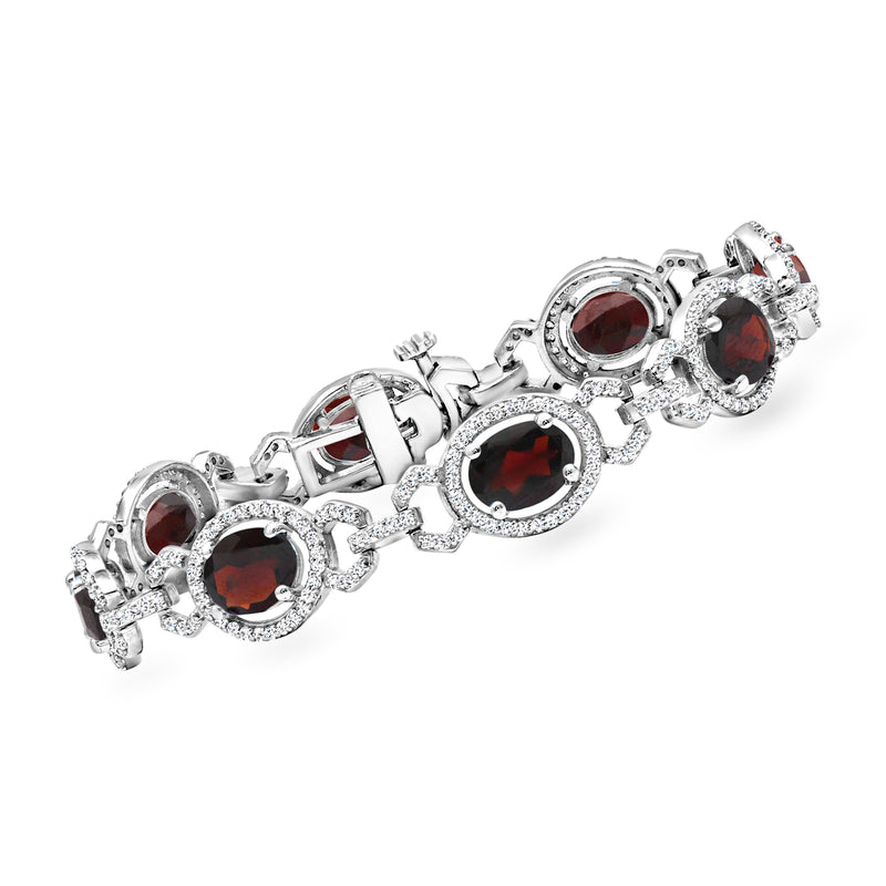 Sterling silver garnet and white topaz bracelet with bezel-set red round stones