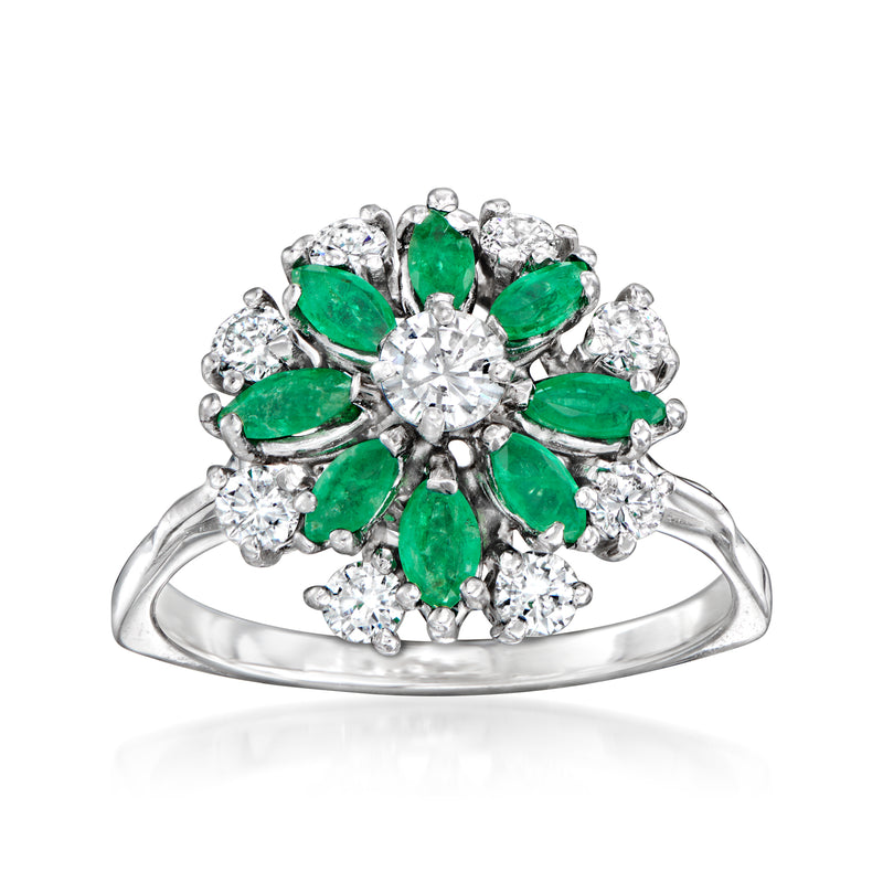 Emerald green flower ring with diamond petals, oval center stone, 14k white gold band