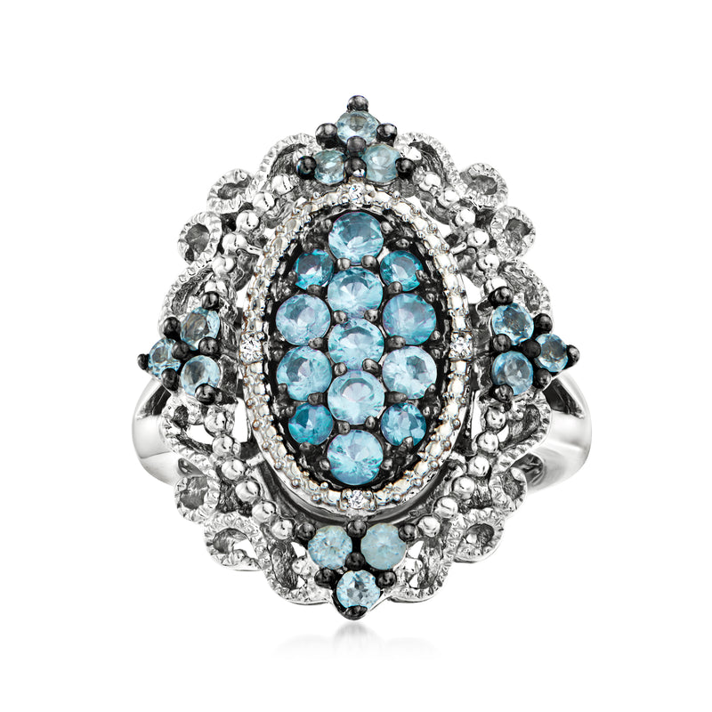 Sterling silver ring with oval blue topaz cluster and diamond accents