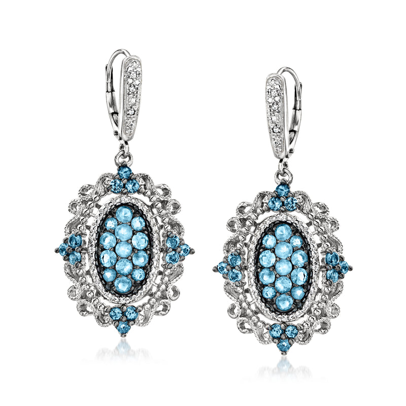 Sterling silver drop earrings with oval blue topaz and diamond accents, leverback