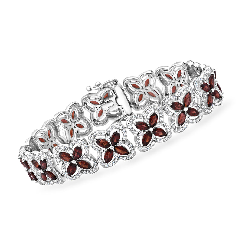 Sterling silver clover station bracelet with red garnet and white stone accents
