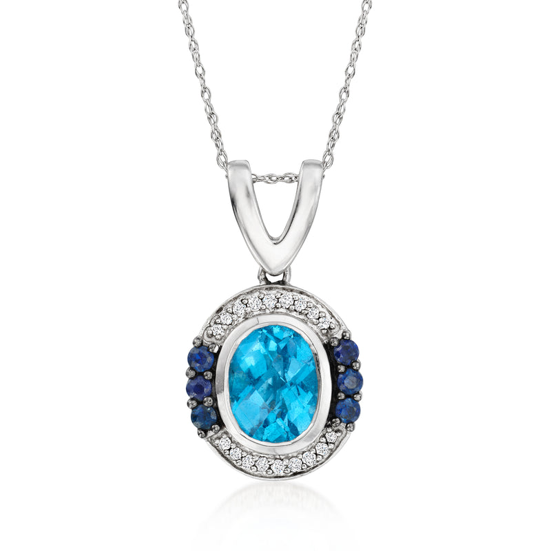 Silver-tone pendant necklace with oval blue gemstone haloed in diamonds and blue sapphire accents