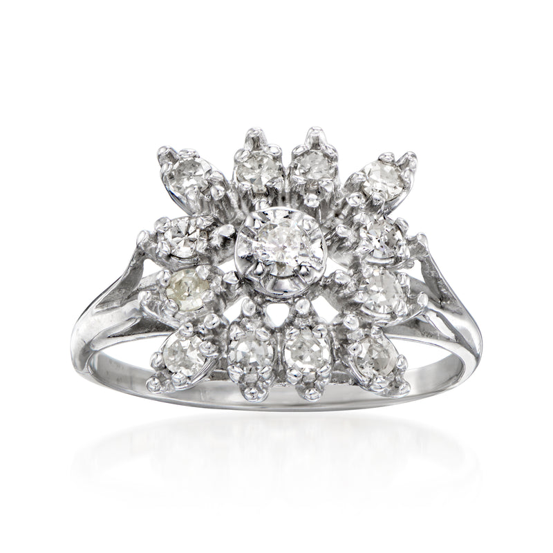 Vintage 14kt white gold diamond cluster ring with round center and pear-shaped side stones