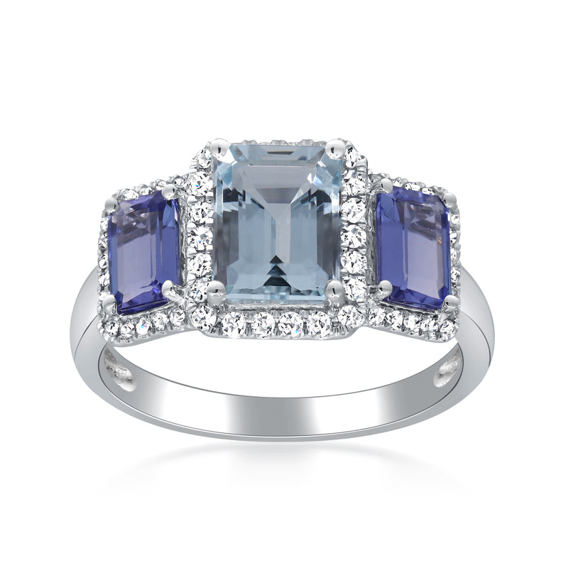 14kt white gold ring with center light blue aquamarine, flanked by blue square stones and diamond accents